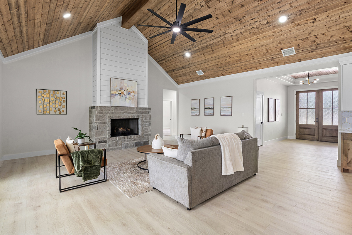 Open great room with cathedral wood ceiling